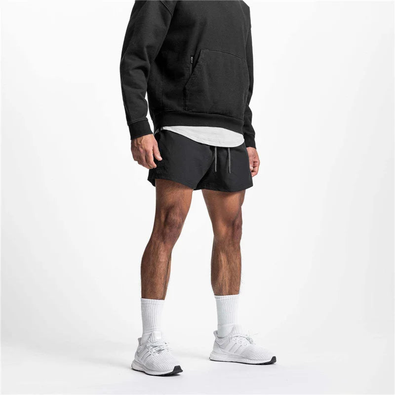 2025 New Summer Men's Sports Shorts Loose Running Gyms Workout Training Breathable Quick drying Shorts Man Brand Short Pants