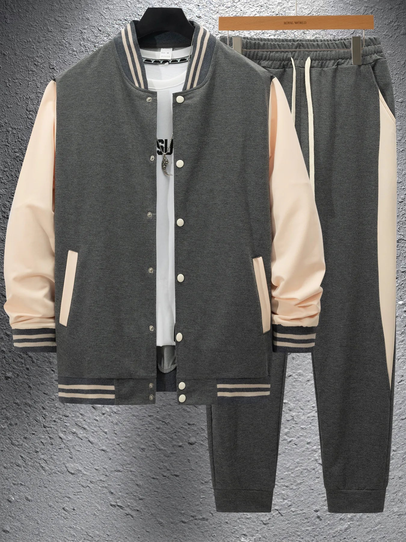 Vintage baseball-style streetwear in autumn and winter, men's color-matched patchwork jacket and tapered pants as a trendy combi